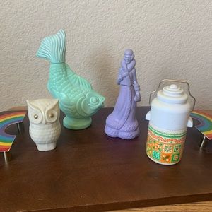 Various AVON products in vintage figurine bottles